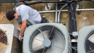 Turin HVAC Specialist servicing a hvac unit that needs attentions