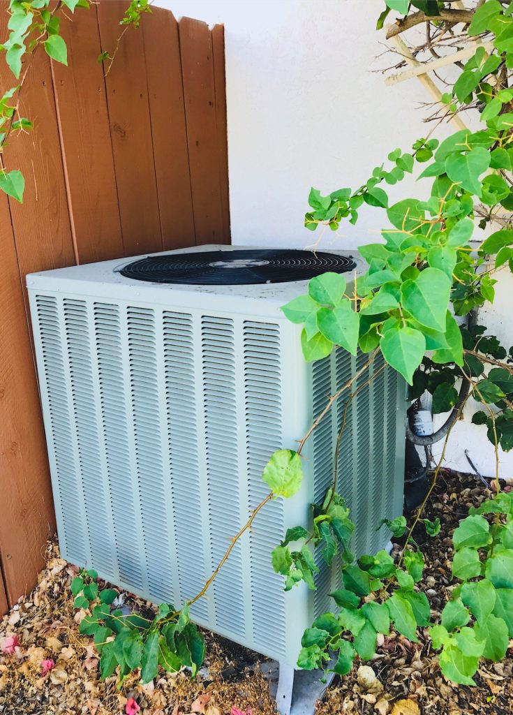 Air conditioning unit on the side of a home in Sharpsburg.